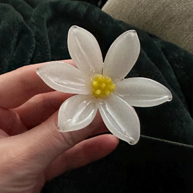 Blossovia customer photo: handmade frosted glass birth flower, real client single stem birthday keepsake